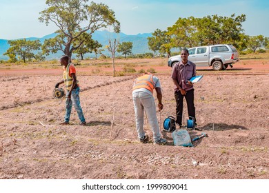 Jos East, Plateau State - May 12, 2021: African Geologist And Team Members Conducting Geophysical Survey For Water Availability In The Ground. Soil Science. Rural Water Project.