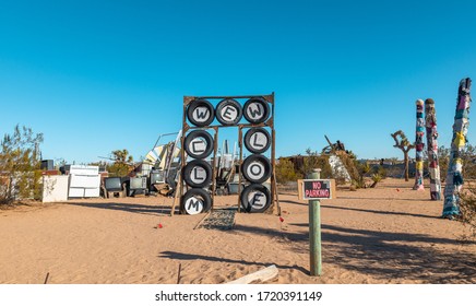 Joshua Tree, CA, USA - 12/24/19: Noah Purifoy Outdoor Desert Art Museum Welcome Sign Made Of Tires