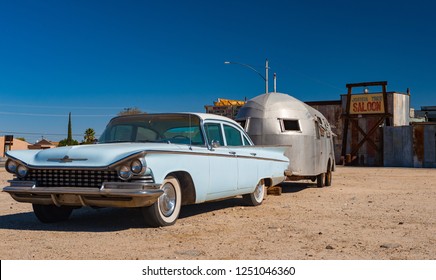 Joshua Tree, California - 30th October, 2012: Vintage late 1950's Buick Electra with vintage trailer parked outside the Joshua tree inn.
