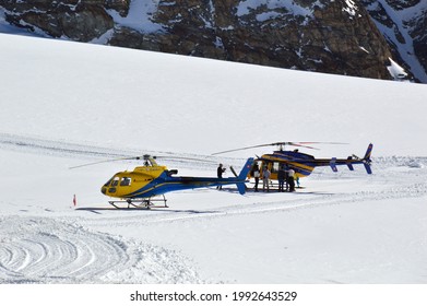 Joungfraujoch, Switzerland - May 20, 2021: The Helicopter Landing On Aletsch Glacier At 3,571m Above Mean Sea Level