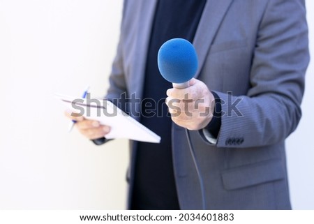 Similar – Image, Stock Photo Journalist holding microphone making media interview