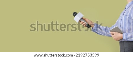 Journalist with microphone on color background with space for text