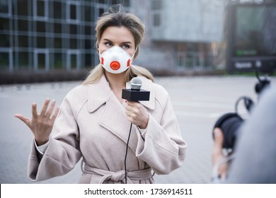 Journalist Wearing Prevention Masks. TV News Reporters Making Reportage About A Virus Epidemic In The City.