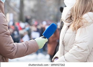 Journalist Wearing Protective Face Mask Against Coronavirus COVID-19 Disease Holding Microphone Making Media Interview During Virus Pandemic