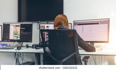 A Journalist Working On A Computer In Newsroom