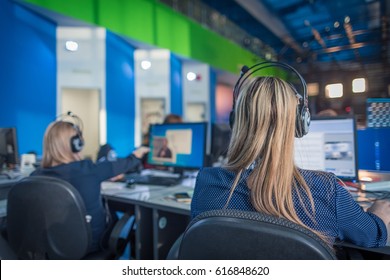 A Journalist Working On A Computer In Newsroom