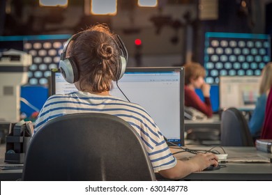 A Journalist Working On A Computer In Newsroom