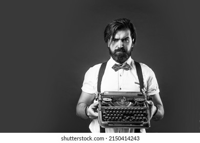 journalistic concept. brutal handsome man with moustache. mature typist use vintage typewriter. masculinity and charisma. formal party dress code. old fashioned bearded hipster