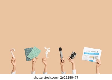 Journalist's female hands with Christmas decorations, notebooks, camera and microphone on beige background - Powered by Shutterstock - Get 15% off with code: PIKWIZARD15