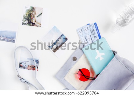 journey planning with tourist outfit on white table background top view