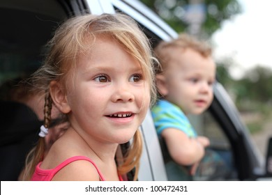 Joy A Child Looks Out From A Car Window