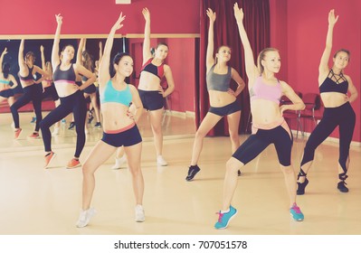 Joyful Active Women Funk Jazz Dancers Exercising Dance Moves In Studio