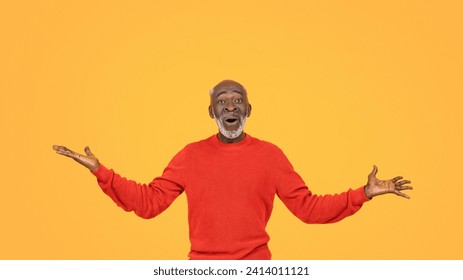 Joyful african american elderly man in vibrant red sweater and matching hat spreads his arms wide with a look of surprise and delight on a sunny yellow background studio, panorama - Powered by Shutterstock