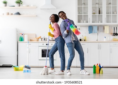 Joyful African American Family Having Fun While Cleaning Kitchen