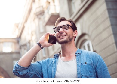 Joyful Attractive Man Speaking On The Phone