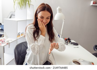 Joyful attractive woman visiting nail beauty salon - Powered by Shutterstock