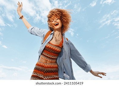 Joyful Beach Adventure: Smiling Woman Dancing with Freedom and Happiness under the Blue Sky - Powered by Shutterstock