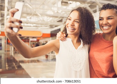 Joyful Black Girls Taking Selfie Photo In Mall