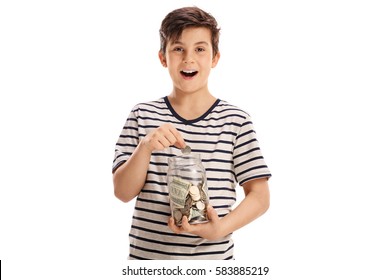 Joyful Boy Putting A Coin Into A Jar With Money Isolated On White Background