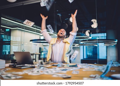Joyful business investor happy with good exchange of bitcoin at online stock platform feeling delight, excited man earning dividend rejoicing with lottery winning at sports betting tossing up money