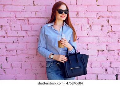 Joyful business woman with coffee in casual outfit and handbag looking away enjoy day - Powered by Shutterstock