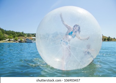 Joyful Children In A Balloon Floating On Water.