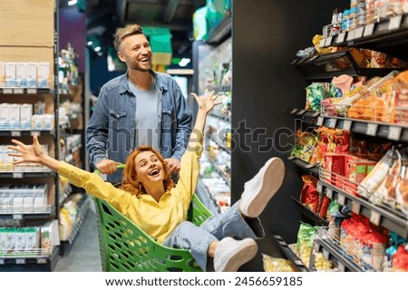 Similar – Image, Stock Photo Beautiful couple having fun in sunflowers field. A man and a woman in love walk in a field with sunflowers, a man hugs a woman. selective focus