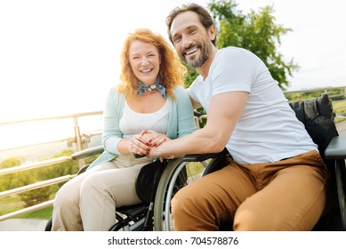 Joyful Disabled Couple Resting In The Park