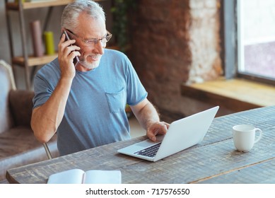 Joyful Elderly Man Talking On Phone