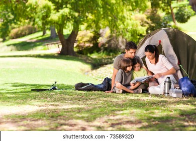 Joyful Family Camping In The Park