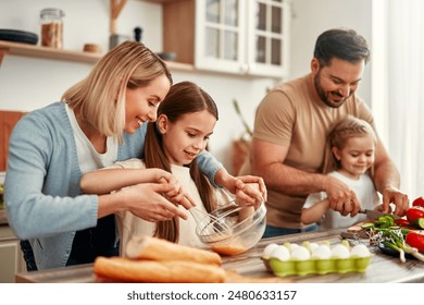 A joyful family comes together to cook with fresh vegetables in a bright kitchen, bonding and having fun while enjoying each others company - Powered by Shutterstock