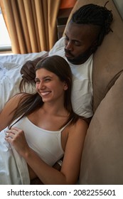 Joyful Female And Serene Male Resting In Bed