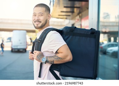 Joyful Food Delivery Guy Smiling While Doing His Job