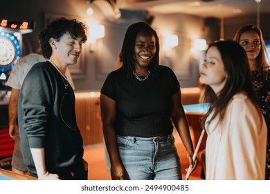 Joyful friends gather for a night out playing billiards and enjoying each other's company in a cozy bar setting - Powered by Shutterstock