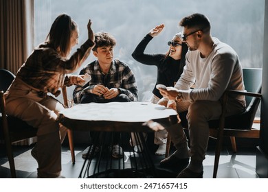 A joyful gathering of young adults engaged in a card game, sharing laughter and high-fives in a cozy indoor setting. - Powered by Shutterstock