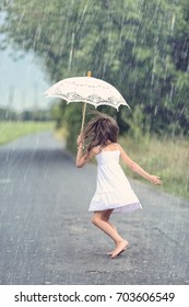 Joyful Girl Dance With Umbrella In Rain