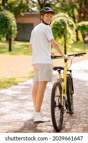 Joyful Guy With Bike Turned His Head