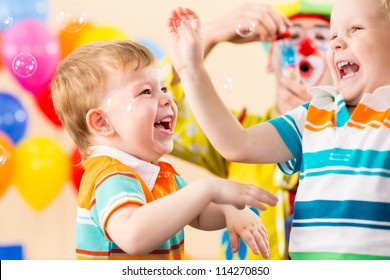 Joyful Kids With Clown On Birthday Party