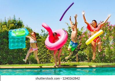 Joyful kids having fun during summer pool party - Powered by Shutterstock