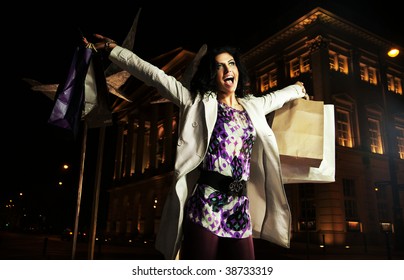 Joyful Lady Holding Shopping Bags, On The Night