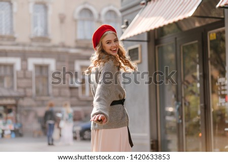 Similar – Image, Stock Photo Young woman and French bulldog on tree trunk at the beach