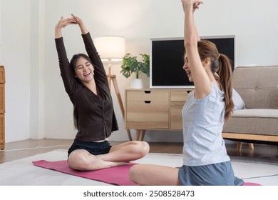 Joyful Lesbian Couple Practicing Yoga and Fitness Indoors - Powered by Shutterstock