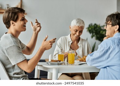 A joyful LGBTQ family shares laughter and delicious breakfast in a sunny kitchen. - Powered by Shutterstock