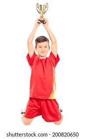 Joyful Little Boy Holding A Trophy Above His Head Isolated On White Background