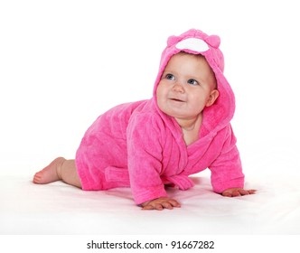 Joyful Little Girl In A Pink Dressing Gown.