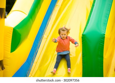 Joyful little girl playing on a trampoline. - Shutterstock ID 302097356