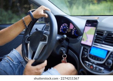 Joyful man driving car, using mobile phone with map gps navigationgoing on trip during summer vacation, Handsome man with beard buying and renting a car, Navigation auto location system app - Shutterstock ID 2274211367