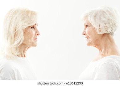 Joyful Mature Female Friends Are Satisfied By Their Appearance