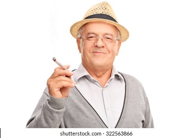 Joyful mature man holding a joint and looking at the camera isolated on white background