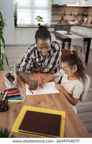 Joyful moments of creativity shared between a child and caregiver